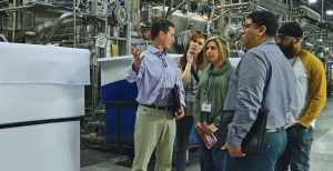 Stacey Bridges (left), vice president of sales, Carolina Cotton Works, explained the company’s dyeing capabilities in detail.