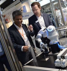 Bernhard Wolz (right), demonstrating Festo’s BionicCobot